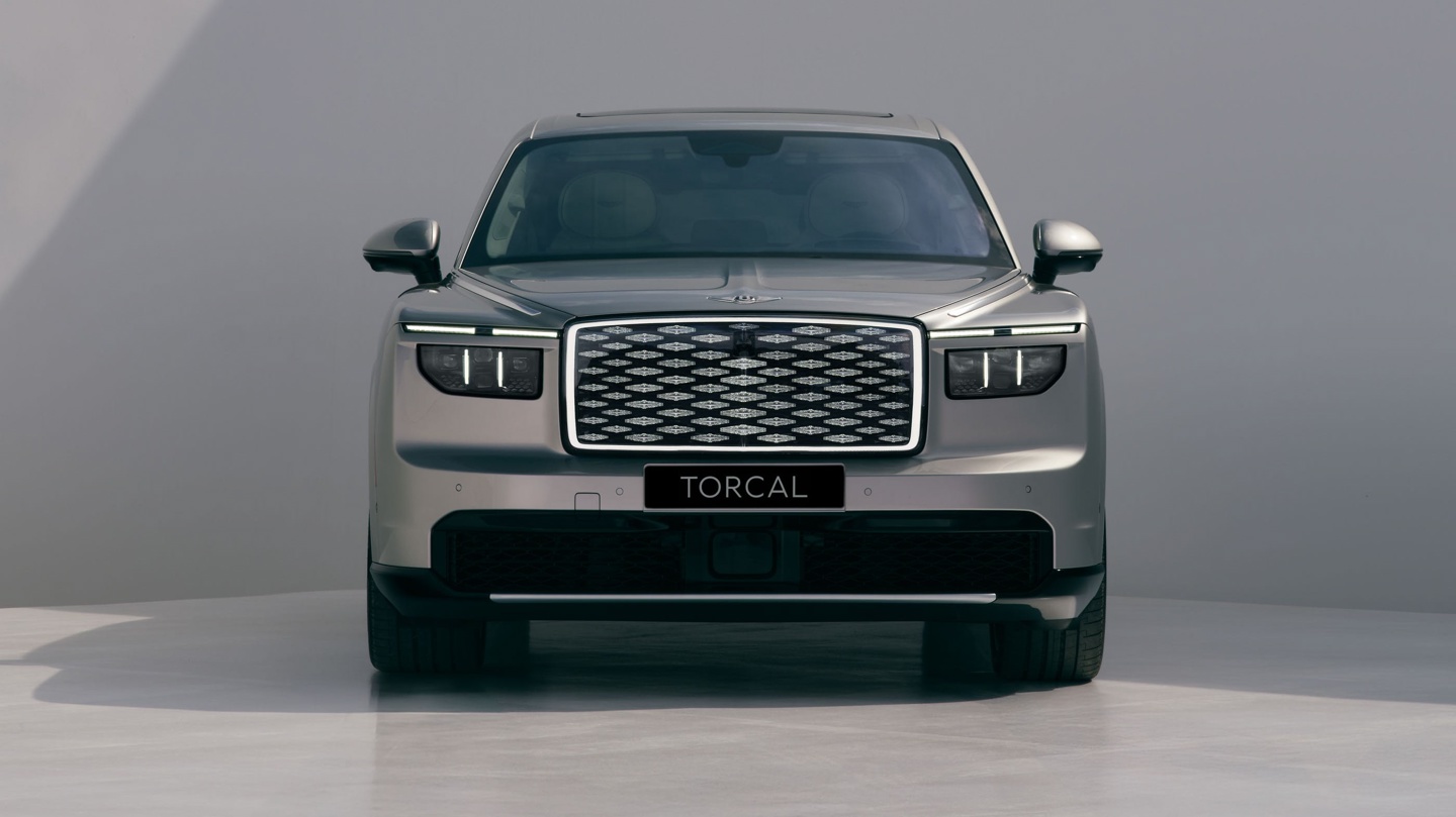 Front view of a modern luxury SUV with a prominent grille and sleek headlights.
